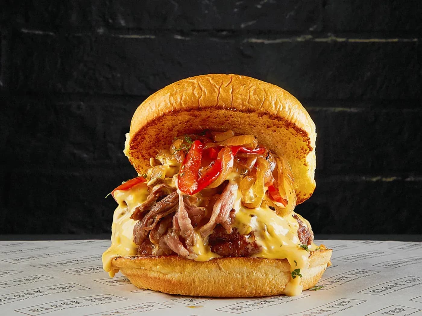 THE PHILLY CHEESE STAKE BURGER